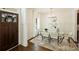 Bright dining room with a modern chandelier, glass table, and stylish decor at 1211 Pinecrest Ave, Charlotte, NC 28205