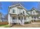 Charming two-story home with a welcoming front porch and well-maintained landscaping at 1211 Pinecrest Ave, Charlotte, NC 28205