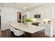 Beautiful kitchen with white cabinets, stainless steel appliances, and a large island with seating at 1211 Pinecrest Ave, Charlotte, NC 28205