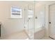 Modern shower with glass enclosure, white subway tile, a built-in niche, and a shower seat at 1211 Pinecrest Ave, Charlotte, NC 28205