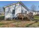 Backyard view with a deck, an air conditioning unit, and a partial view of the house at 1213 Cloninger Ave, Gastonia, NC 28052
