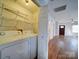 Laundry room with washer, dryer, and shelving, offering convenience and organization at 1213 Cloninger Ave, Gastonia, NC 28052