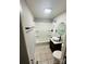 Updated bathroom featuring a modern vanity, stylish mirror, and tub-shower combination at 128 N Oak St, Salisbury, NC 28146