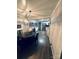 Kitchen and dining area featuring new flooring, new light fixtures, new paint, and stainless steel appliances at 128 N Oak St, Salisbury, NC 28146