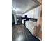 Updated kitchen featuring white cabinets, granite countertops, stainless steel appliances and modern fixtures at 128 N Oak St, Salisbury, NC 28146