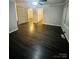 Spacious living room featuring new flooring, fresh paint, generous room dimensions, and contemporary finishes at 128 N Oak St, Salisbury, NC 28146