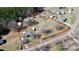 Expansive property showcasing the house, outbuildings, and land outlined in red at 1354 Mirror Lake Rd, Lincolnton, NC 28092