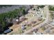 Aerial view of a property featuring mature trees, buildings, and surrounding landscape at 1354 Mirror Lake Rd, Lincolnton, NC 28092