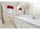 Bathroom featuring dual sinks, decorative mirror and patterned floor at 1354 Mirror Lake Rd, Lincolnton, NC 28092