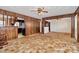 Open-concept living room with wood trim and access to the kitchen and other living spaces at 1354 Mirror Lake Rd, Lincolnton, NC 28092