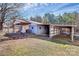 Rear exterior view of the outbuilding including a drive-through and a covered porch at 1354 Mirror Lake Rd, Lincolnton, NC 28092