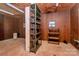 Rustic storage area with pegboard walls, metal and wooden shelving, and a small window for natural light at 1354 Mirror Lake Rd, Lincolnton, NC 28092