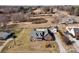 Aerial view of a lovely brick home with a well-manicured lawn and mature landscaping at 144 Cameron Dr, Salisbury, NC 28147