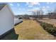 View of the backyard showing the spacious green lawn and full privacy fence at 144 Cameron Dr, Salisbury, NC 28147