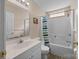 Bathroom featuring white vanity with a tub and shower combo with a striped curtain at 144 Cameron Dr, Salisbury, NC 28147
