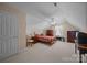 Cozy bedroom with carpet flooring, a ceiling fan, and a window for natural light at 144 Cameron Dr, Salisbury, NC 28147