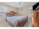 Bedroom with a wooden bed frame, ceiling fan, and a window offering natural light at 144 Cameron Dr, Salisbury, NC 28147