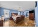 The bedroom is a tranquil haven with natural light and hardwood floors at 144 Cameron Dr, Salisbury, NC 28147
