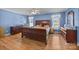 Primary bedroom features a large window for natural light and hardwood flooring at 144 Cameron Dr, Salisbury, NC 28147