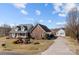 View of the front of this home showcasing the manicured landscaping, brick facade, and covered front porch at 144 Cameron Dr, Salisbury, NC 28147