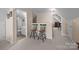 Hallway with multiple entrances and neutral carpeting, leading to other areas of the home at 144 Cameron Dr, Salisbury, NC 28147