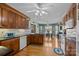 Spacious kitchen with wooden cabinets, modern appliances, hardwood floors, and a view of the dining area at 144 Cameron Dr, Salisbury, NC 28147