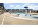 Community pool area featuring a splash pad with mushroom water features and lounge seating at 14815 Rivergate Parkway Pkwy, Charlotte, NC 28273