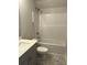 Bathroom features bathtub and shower combination with white fixtures and a gray vanity at 160 Swann Rd # 6, Statesville, NC 28625