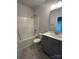 Bathroom features gray vanity, solid surface countertops, bathtub and shower combination with white fixtures at 160 Swann Rd # 6, Statesville, NC 28625