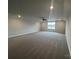 Large bonus room with neutral carpet, recessed lighting, ceiling fan, and plenty of space at 160 Swann Rd # 6, Statesville, NC 28625