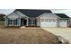 Charming single-story home with stone accents, a two-car garage, and professionally landscaped yard at 160 Swann Rd # 6, Statesville, NC 28625