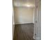 Simple bedroom with grey wood-look flooring and neutral walls at 1606 Lincoln Dr, Shelby, NC 28152