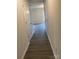 Bright hallway with light grey wood-look flooring at 1606 Lincoln Dr, Shelby, NC 28152