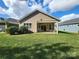 This home includes a covered back porch and nicely manicured lawn at 184 Flat Rock Dr, Denver, NC 28037