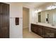 Bathroom featuring double vanity, large mirror, and neutral color palette at 184 Flat Rock Dr, Denver, NC 28037