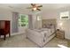 Cozy bedroom with a ceiling fan, natural light, and neutral decor at 184 Flat Rock Dr, Denver, NC 28037
