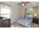 Bright bedroom with a ceiling fan, with neutral carpet and large windows at 184 Flat Rock Dr, Denver, NC 28037