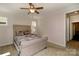 Comfortable bedroom with a ceiling fan, natural light, and neutral decor at 184 Flat Rock Dr, Denver, NC 28037