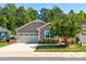 Charming home with a two-car garage, landscaped yard, and craftsman details at 184 Flat Rock Dr, Denver, NC 28037