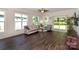 Bright living area featuring wood floors, a ceiling fan, and access to back yard at 184 Flat Rock Dr, Denver, NC 28037
