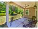 Covered outdoor patio with ceiling fan, view of yard at 184 Flat Rock Dr, Denver, NC 28037