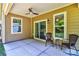 Covered outdoor patio with view of the lush backyard at 184 Flat Rock Dr, Denver, NC 28037