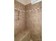 Tiled shower featuring a built-in bench and tiled accent stripe at 184 Flat Rock Dr, Denver, NC 28037