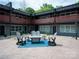 Cozy courtyard with Adirondack chairs, a fire pit, and a tranquil ambiance at 2000 Patio Ct # 101, Charlotte, NC 28205