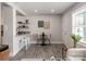 Bright dining area featuring hardwood floors, a table with seating for two, and natural light at 2000 Patio Ct # 101, Charlotte, NC 28205