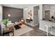 Stylishly decorated living room featuring hardwood floors, a cozy seating area, and a workspace at 2000 Patio Ct # 101, Charlotte, NC 28205