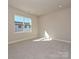 Bright and spacious bedroom with carpet flooring and large window at 207 Halemarge Drive Dr, Belmont, NC 28012