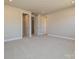 Spacious bedroom with carpet and access to closets at 207 Halemarge Drive Dr, Belmont, NC 28012