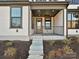 Inviting front porch with gray flooring and metal railing at 207 Halemarge Drive Dr, Belmont, NC 28012