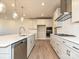 Modern kitchen with stainless steel appliances and hardwood floors at 207 Halemarge Drive Dr, Belmont, NC 28012